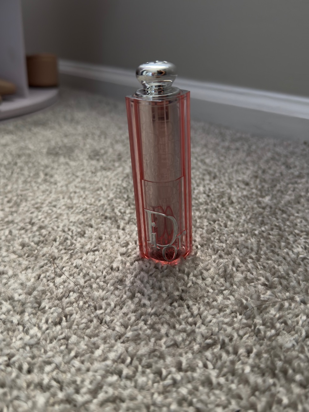 Cosmetic item on carpet